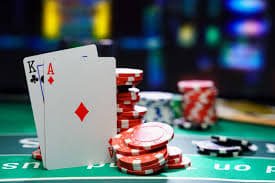Simbol Wild dan Scatter yang memicu fitur bonus Simbol Wild dan Scatter dalam permainan Bonanza Gold